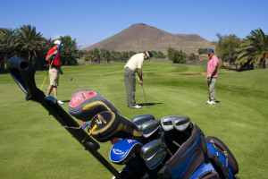 3 people playing Golf